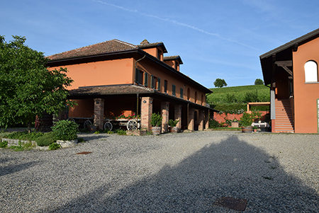 A view of the courtyard between the farmhouse and the &quot;Grapes&quot; apartment