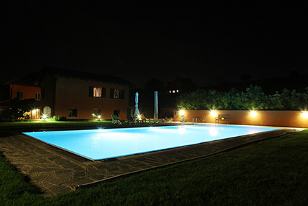 Our pool by night with the &quot;Grapes&quot; apartment in the background